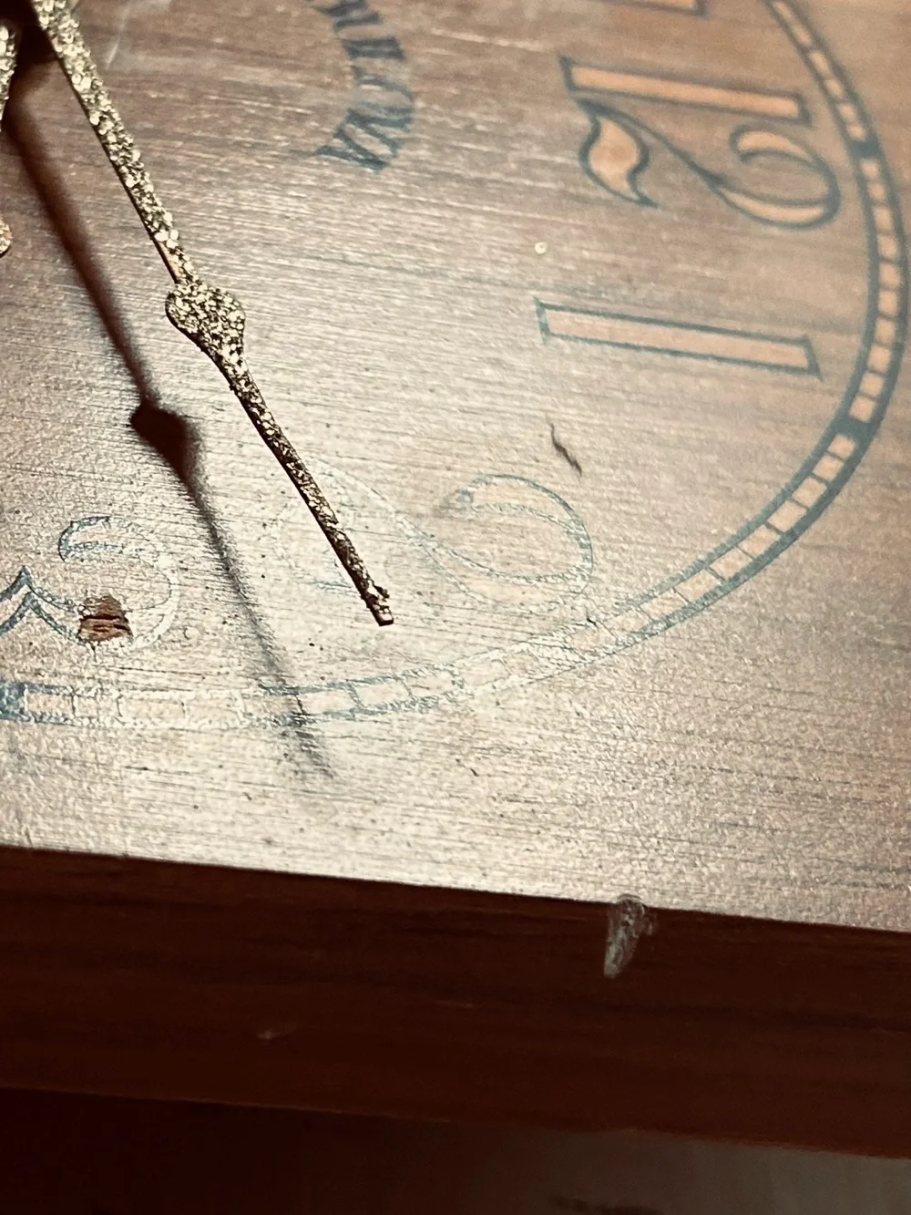 Bulova wall clock features a unique wooden casing shaped like a stylized ship